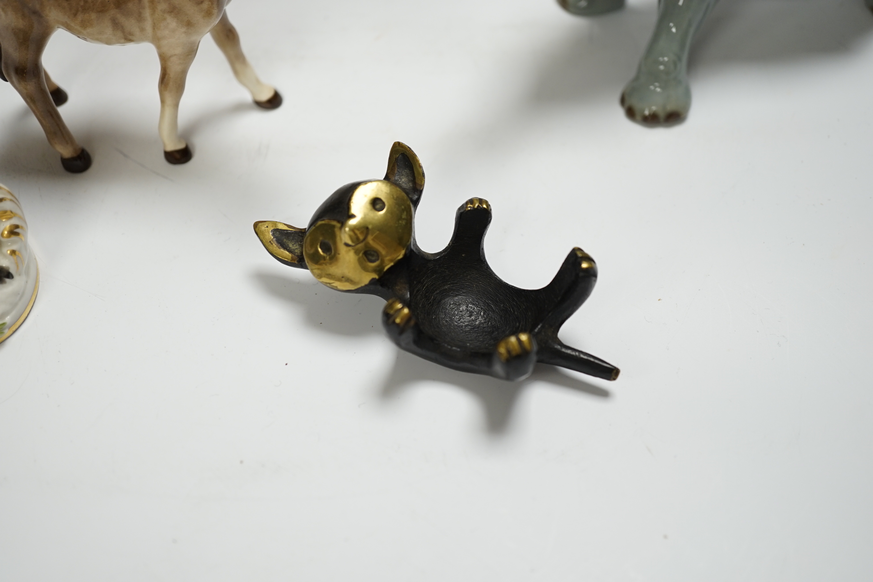 Eight animals including four Beswick, a Szeiler, a Royal Copenhagen, a cast metal cat and a Schierhols and Sohn, tallest 19.5cm